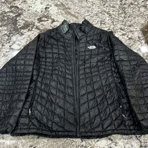 The North Face women’s Thermoball jacket, lands right at the hip.  XXL